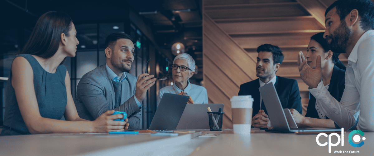 People discussing in a leadership meeting 